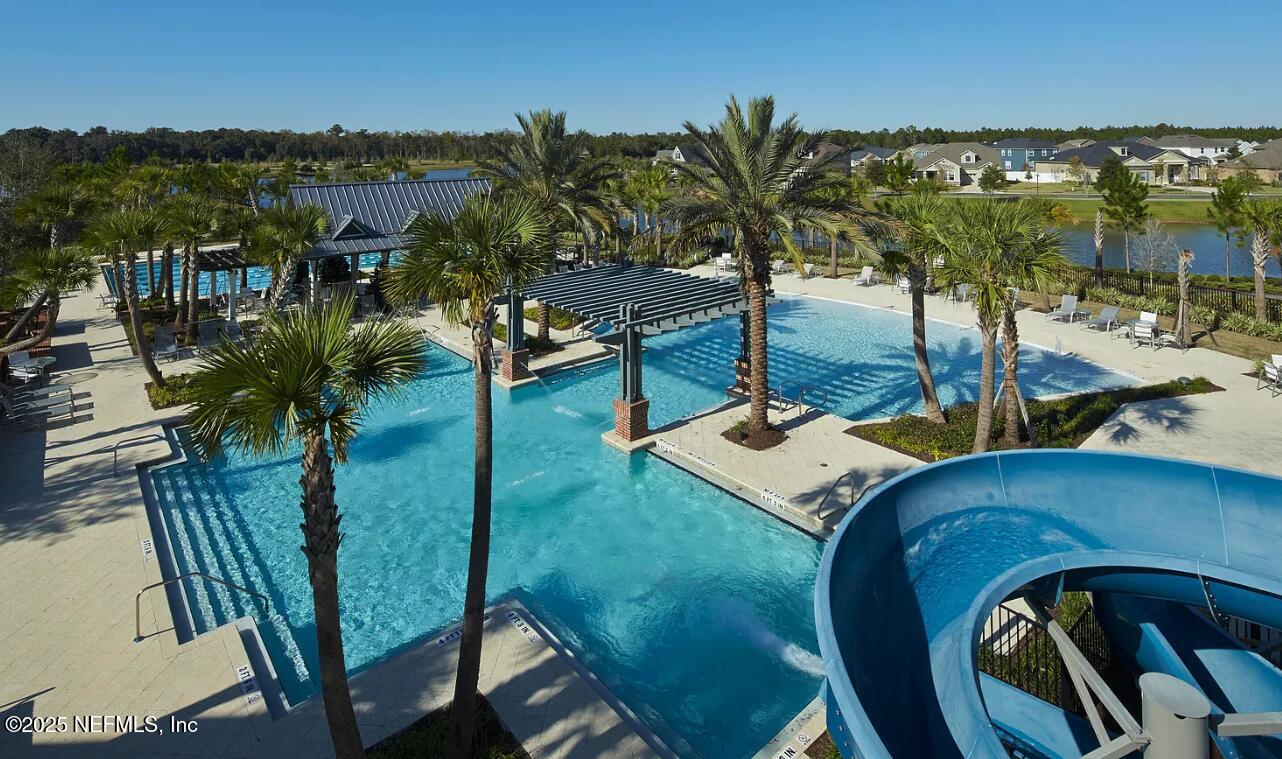 44 Footbridge Road St. Johns, FL 32259 - Photo 41 of 45 a view of a backyard with plants and lake view