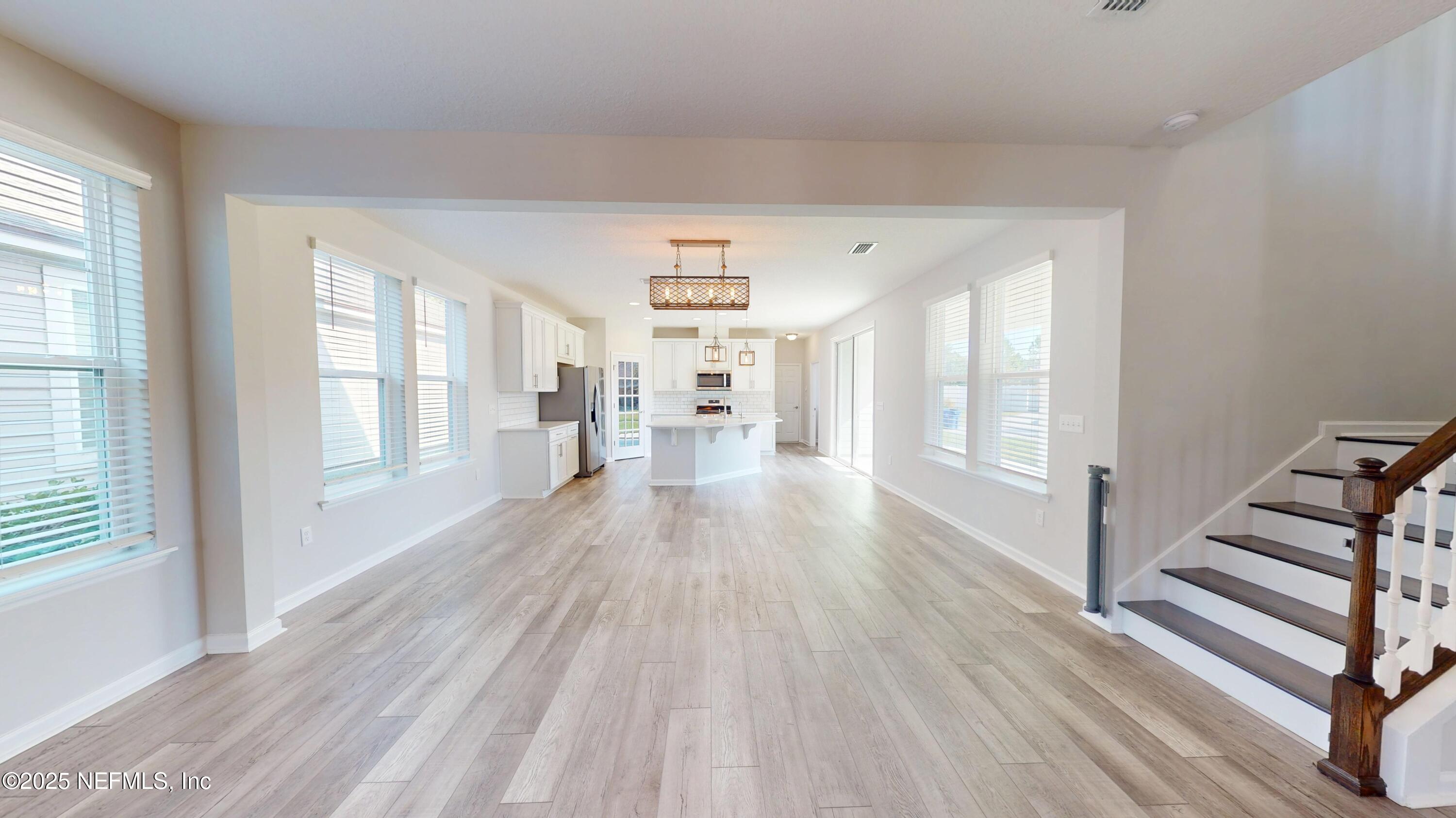 44 Footbridge Road St. Johns, FL 32259 - Photo 5 of 45 a view of a room with wooden floor and windows