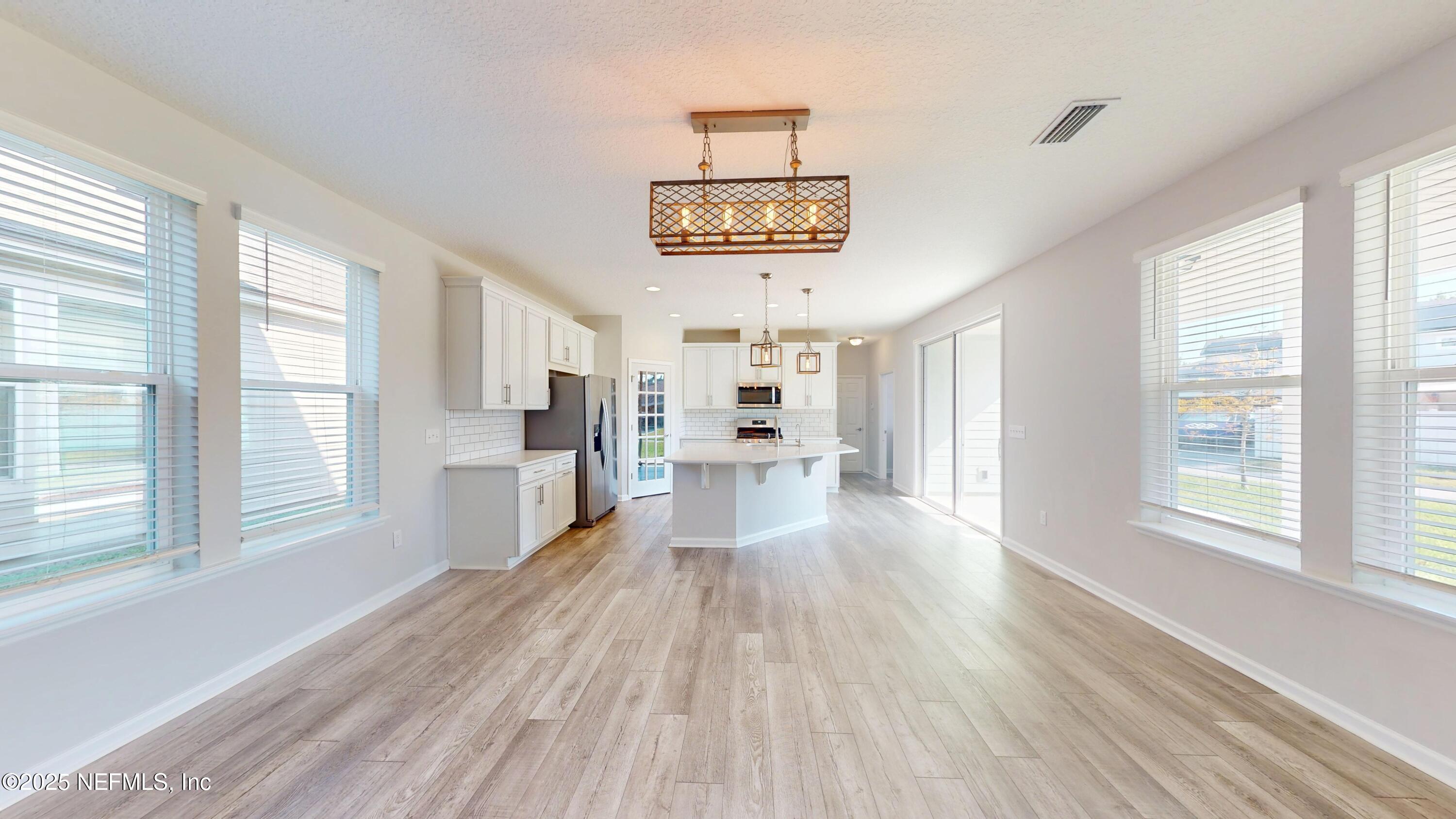 44 Footbridge Road St. Johns, FL 32259 - Photo 7 of 45 a view of a kitchen with wooden floor and a kitchen