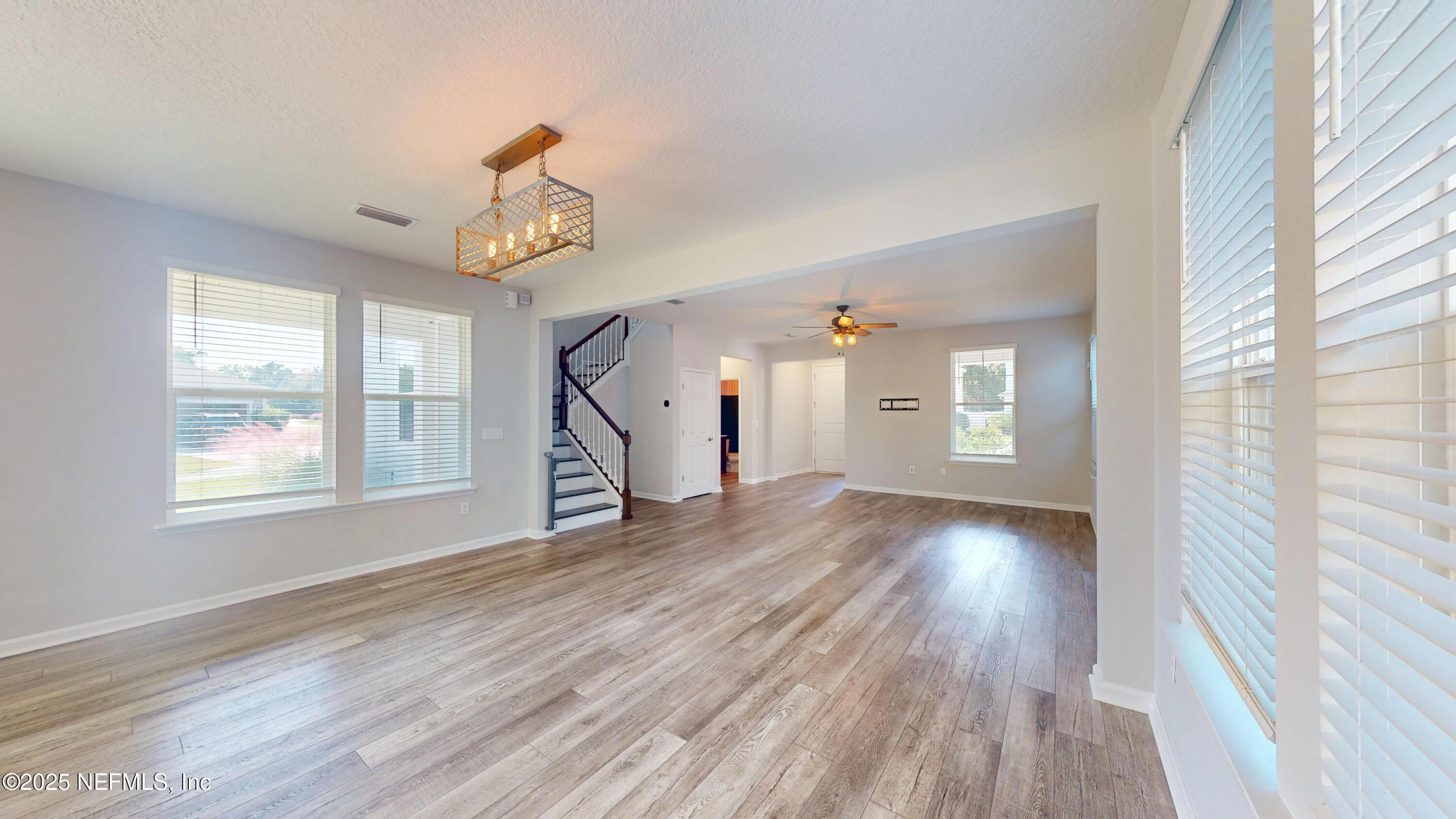 44 Footbridge Road St. Johns, FL 32259 - Photo 9 of 45 a view of an empty room with wooden floor and a window