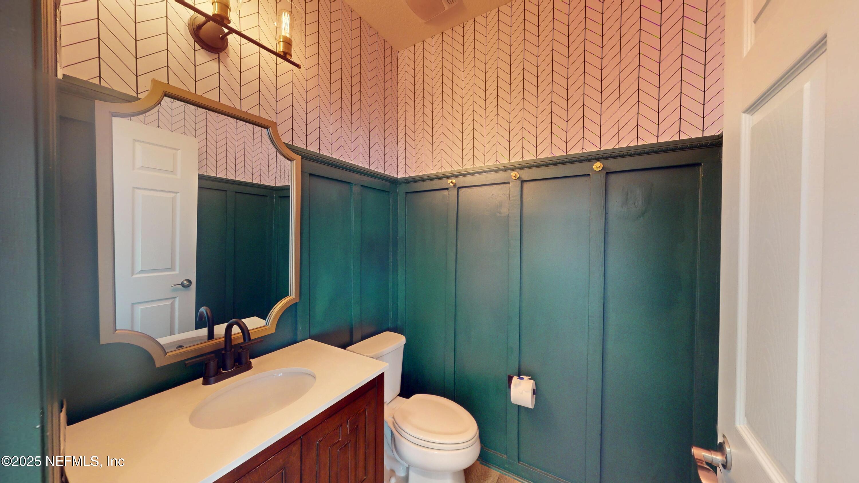 44 Footbridge Road St. Johns, FL 32259 - Photo 10 of 45 a bathroom with a sink a toilet and mirror