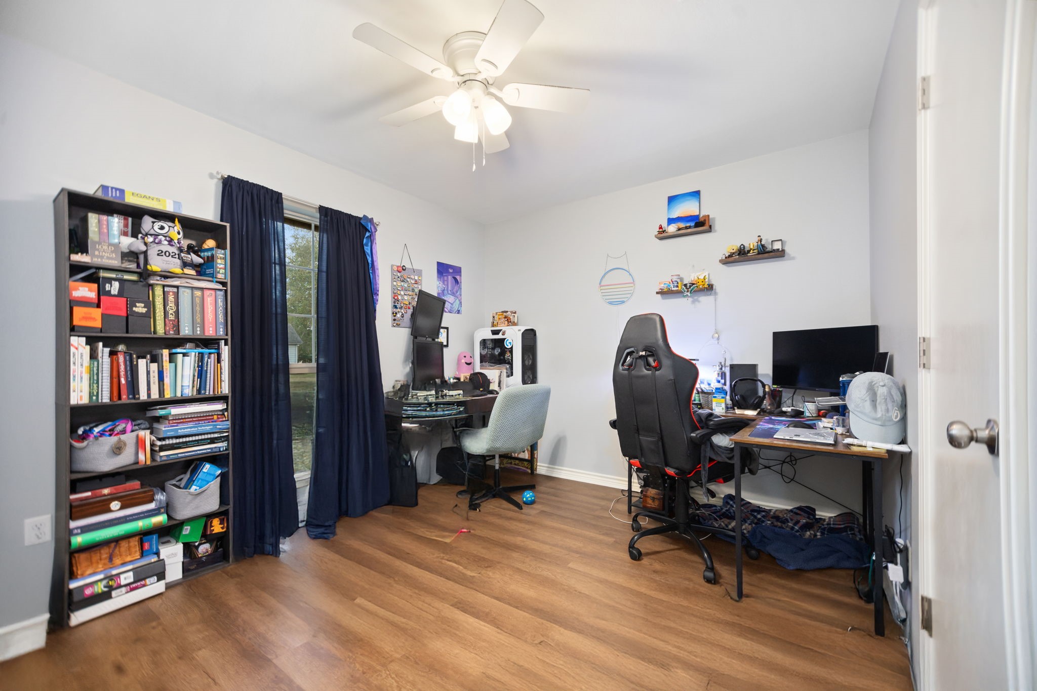 103 Quail Ridge Drive Nacogdoches, TX 75961 - Photo 17 of 28 a view of a workspace with furniture and a bookshelf