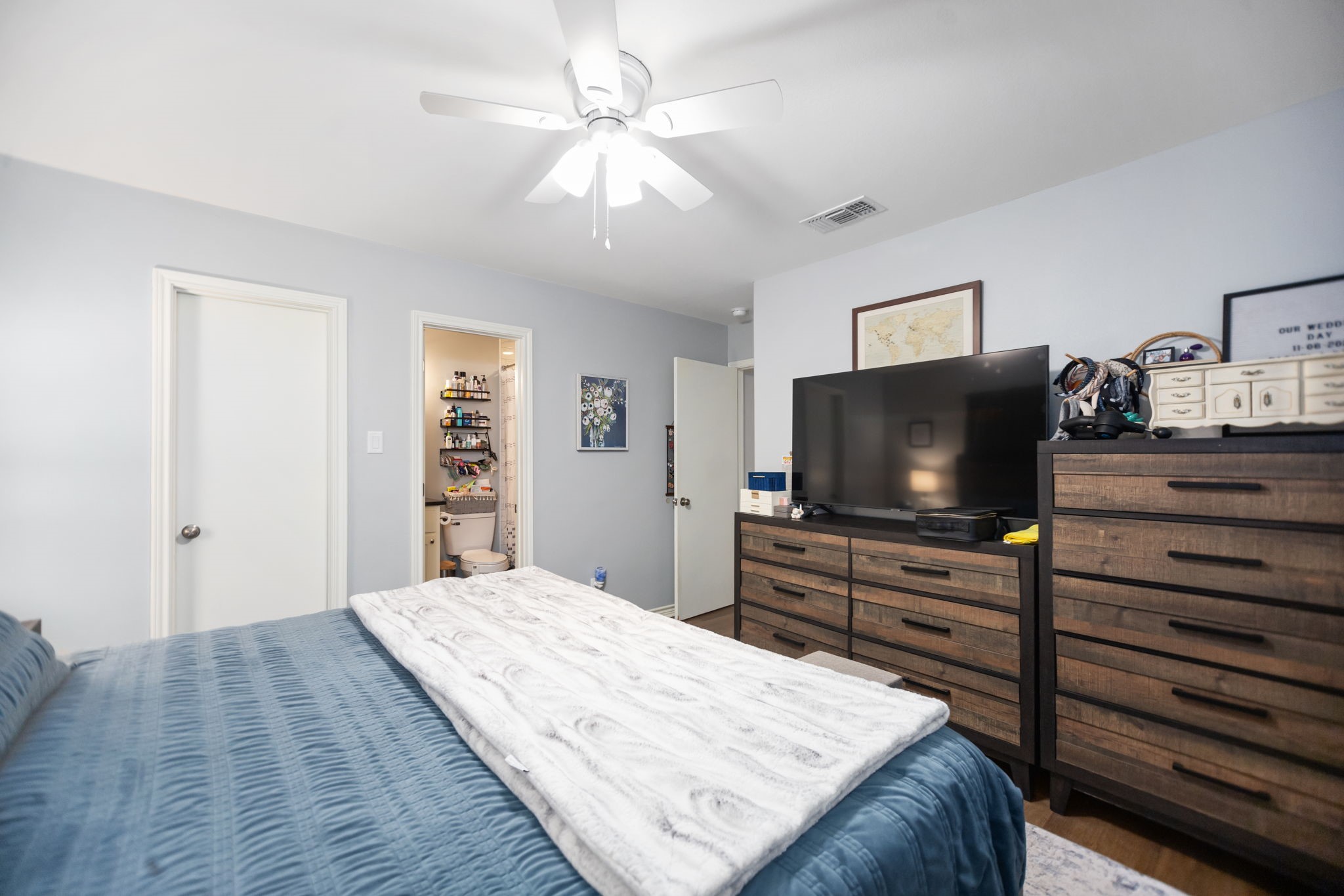 103 Quail Ridge Drive Nacogdoches, TX 75961 - Photo 20 of 28 a bedroom with a bed and a flat screen tv in it