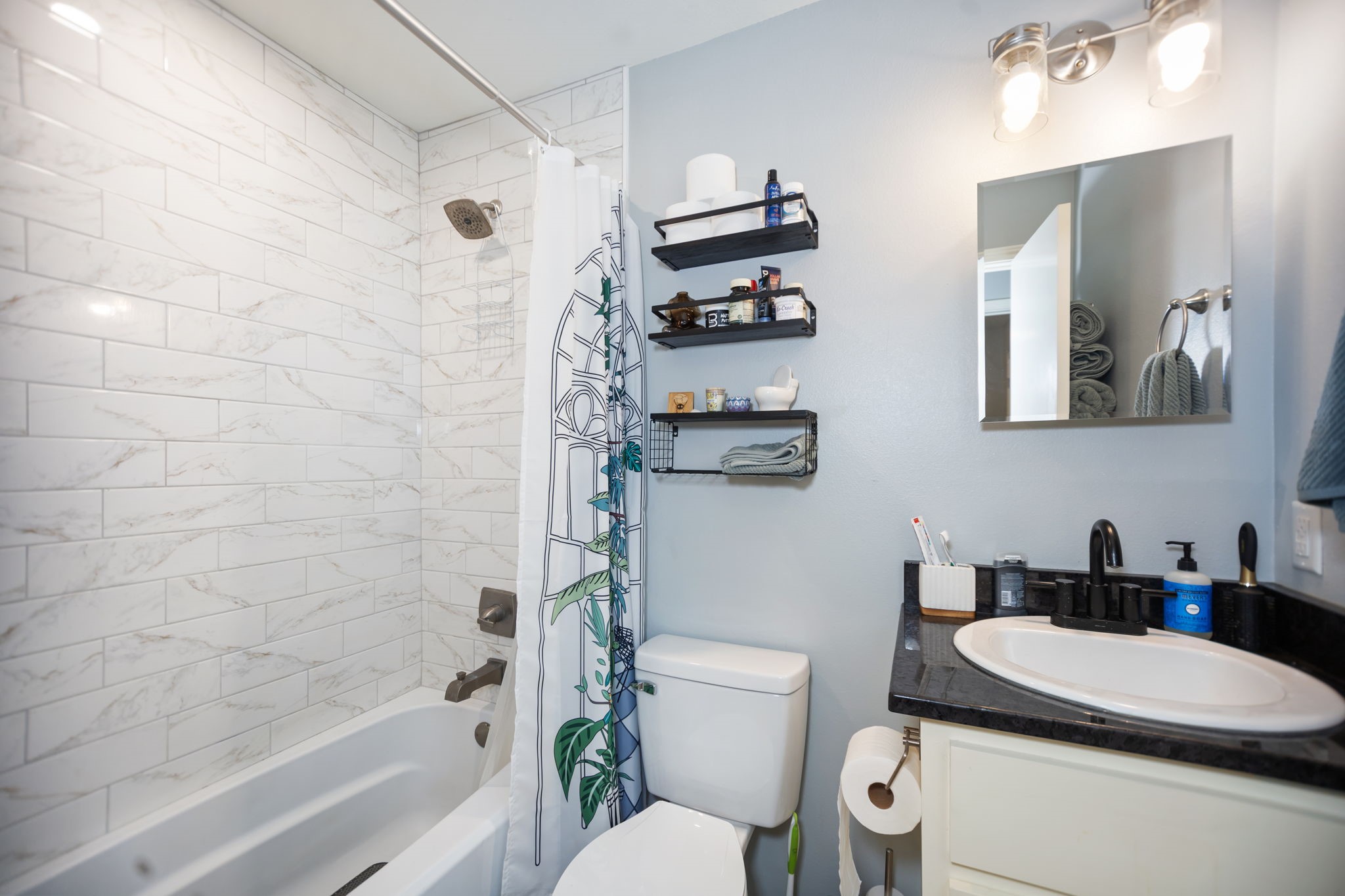 103 Quail Ridge Drive Nacogdoches, TX 75961 - Photo 22 of 28 a bathroom with a sink a toilet and shower