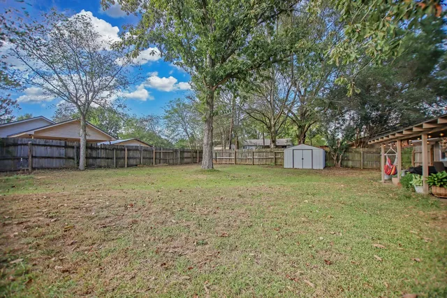 a backyard of a house with lots of green space