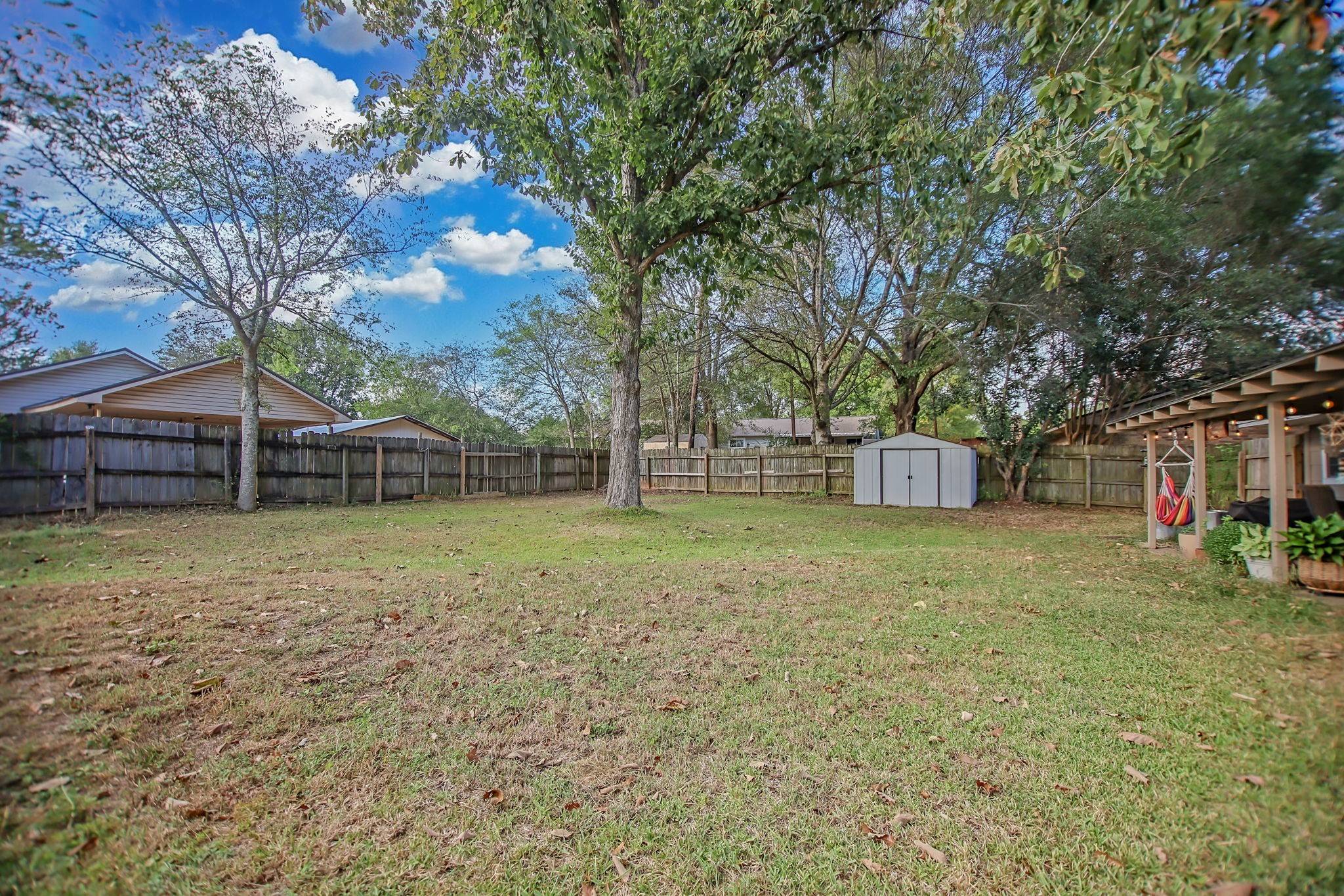 103 Quail Ridge Drive Nacogdoches, TX 75961 - Photo 26 of 28 a backyard of a house with lots of green space