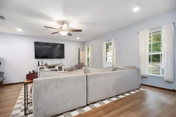 a living room with furniture and a flat screen tv