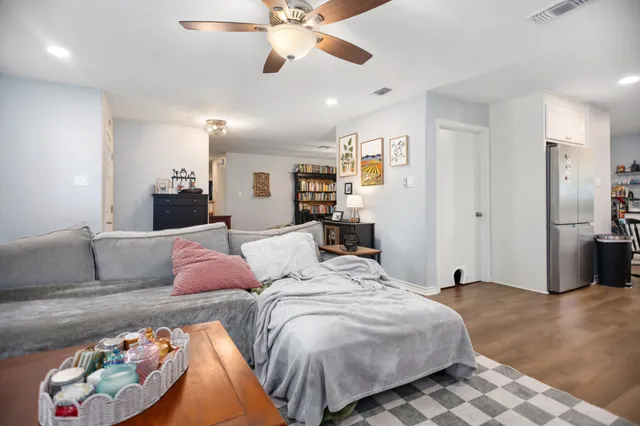 a bedroom with a bed and ceiling fan