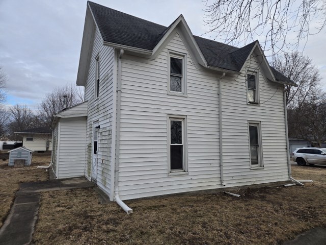 401 Northeast 3rd Street Aledo, IL 61231 - Photo 12 of 12 a view of a white house with a yard