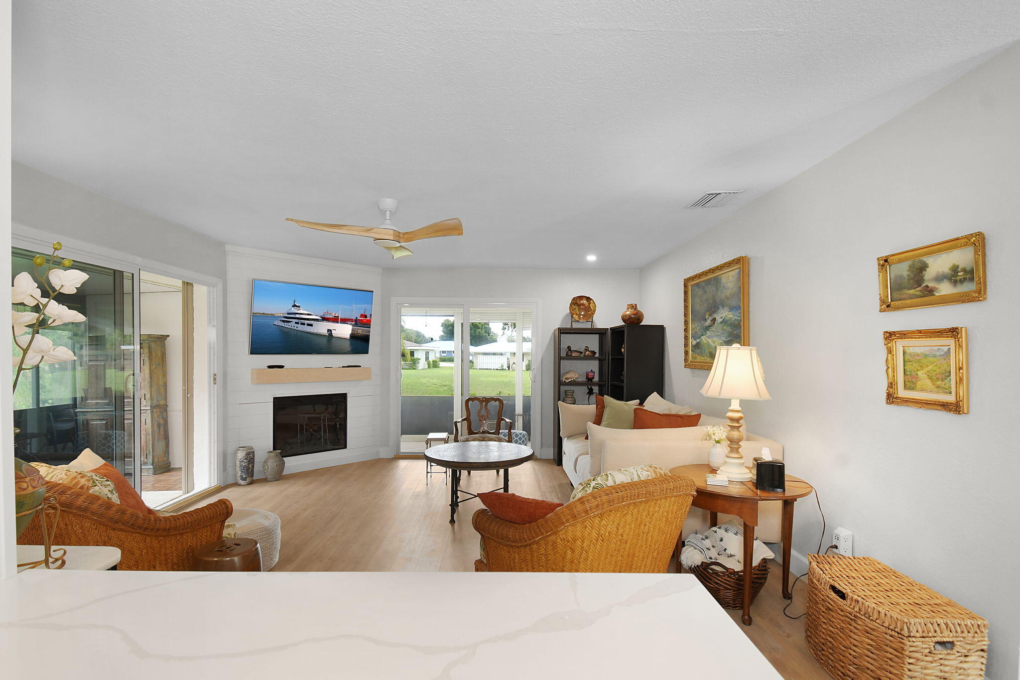 5251 Southeast Sea Island Way Stuart, FL 34997 - Photo 15 of 68 a living room with furniture and a fireplace