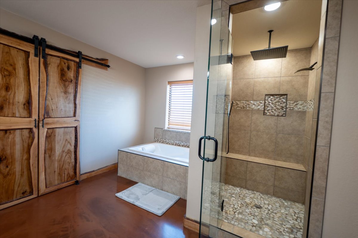 1825 Savanna Ridge Ranch Road Lometa, TX 76853 - Photo 13 of 35 Bathroom featuring a bath, a stall shower, and recessed lighting