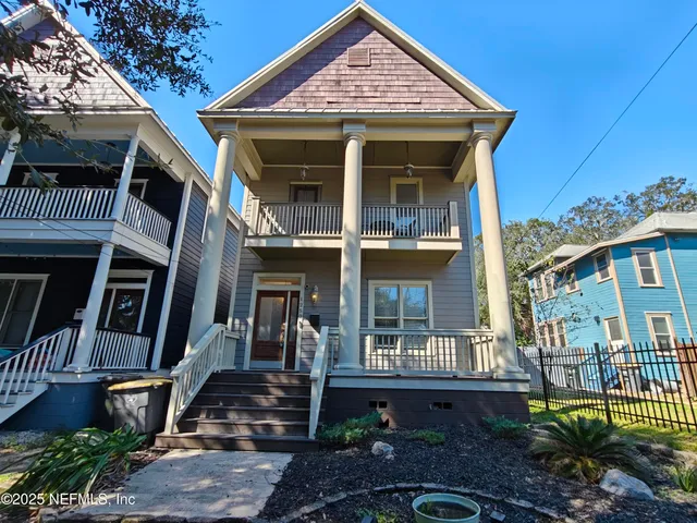 a view of a porch with wooden floor