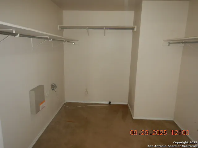 a view of an empty walk in closet