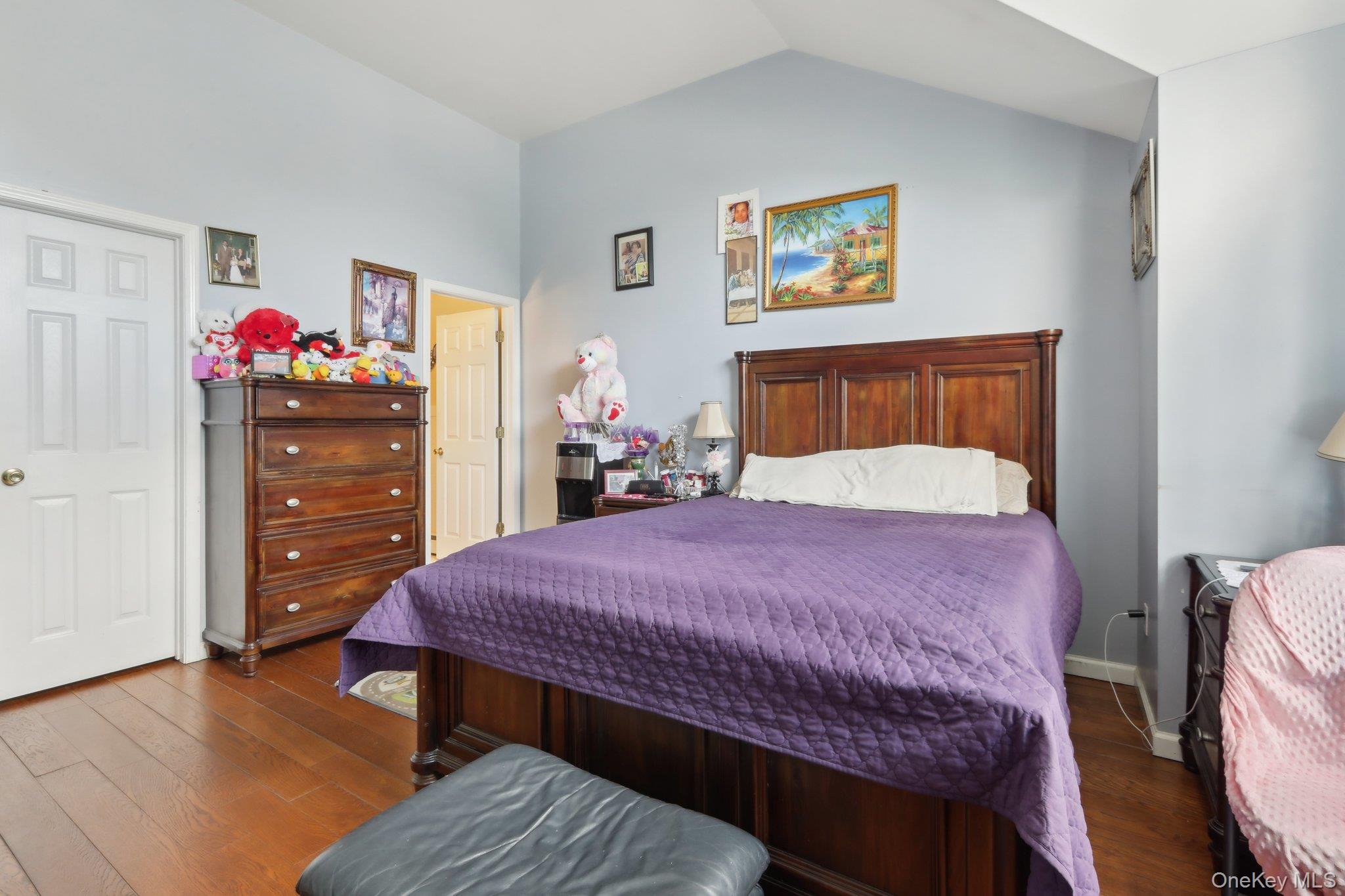12-14 Lincoln Street Spring Valley, NY 10977 - Photo 21 of 39 a bedroom with a bed a dresser and wooden floor