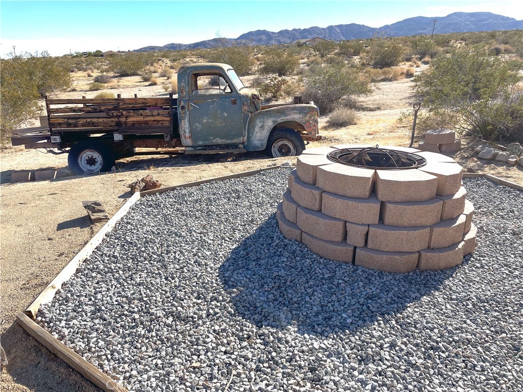 68033 Sullivan Road Twentynine Palms, CA 92277 - Photo 18 of 30 BACK PATIO AREA FIRE PIT