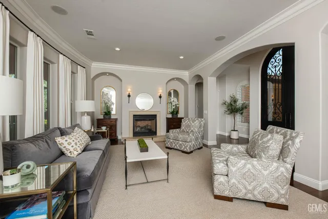 a large kitchen with a lot of counter space and wooden floor