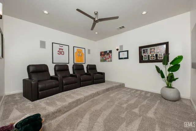 a kitchen with stainless steel appliances granite countertop a sink and a refrigerator