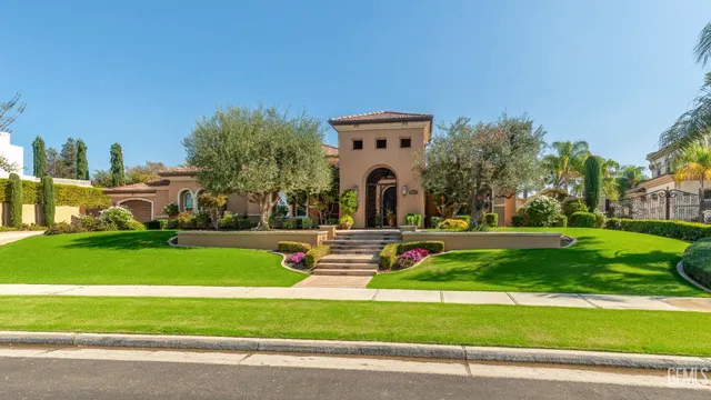 an aerial view of a house with a swimming pool yard and outdoor seating