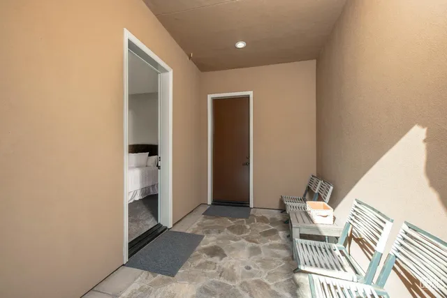 a front view of a house with a yard table and chairs