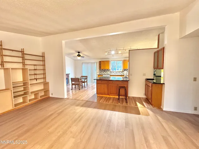 a view of kitchen with sink and wooden floor