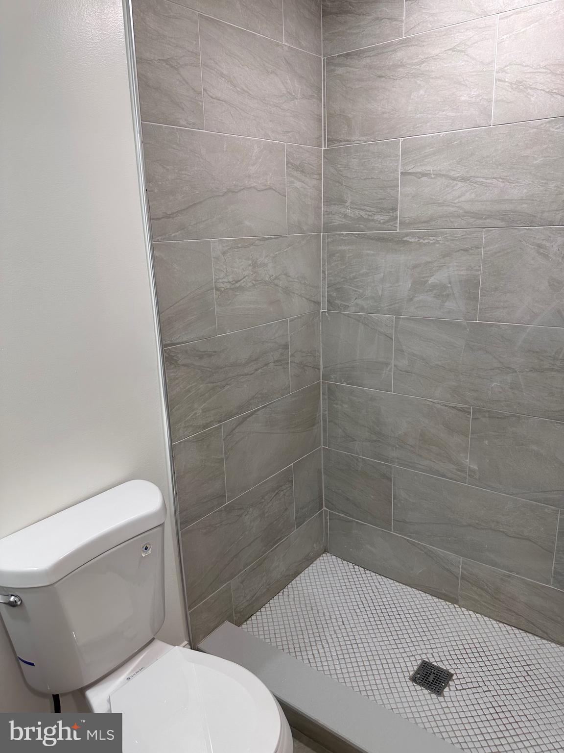 458 Federal Street Baltimore, MD 21202 - Photo 4 of 4 a bathroom with a toilet and a shower