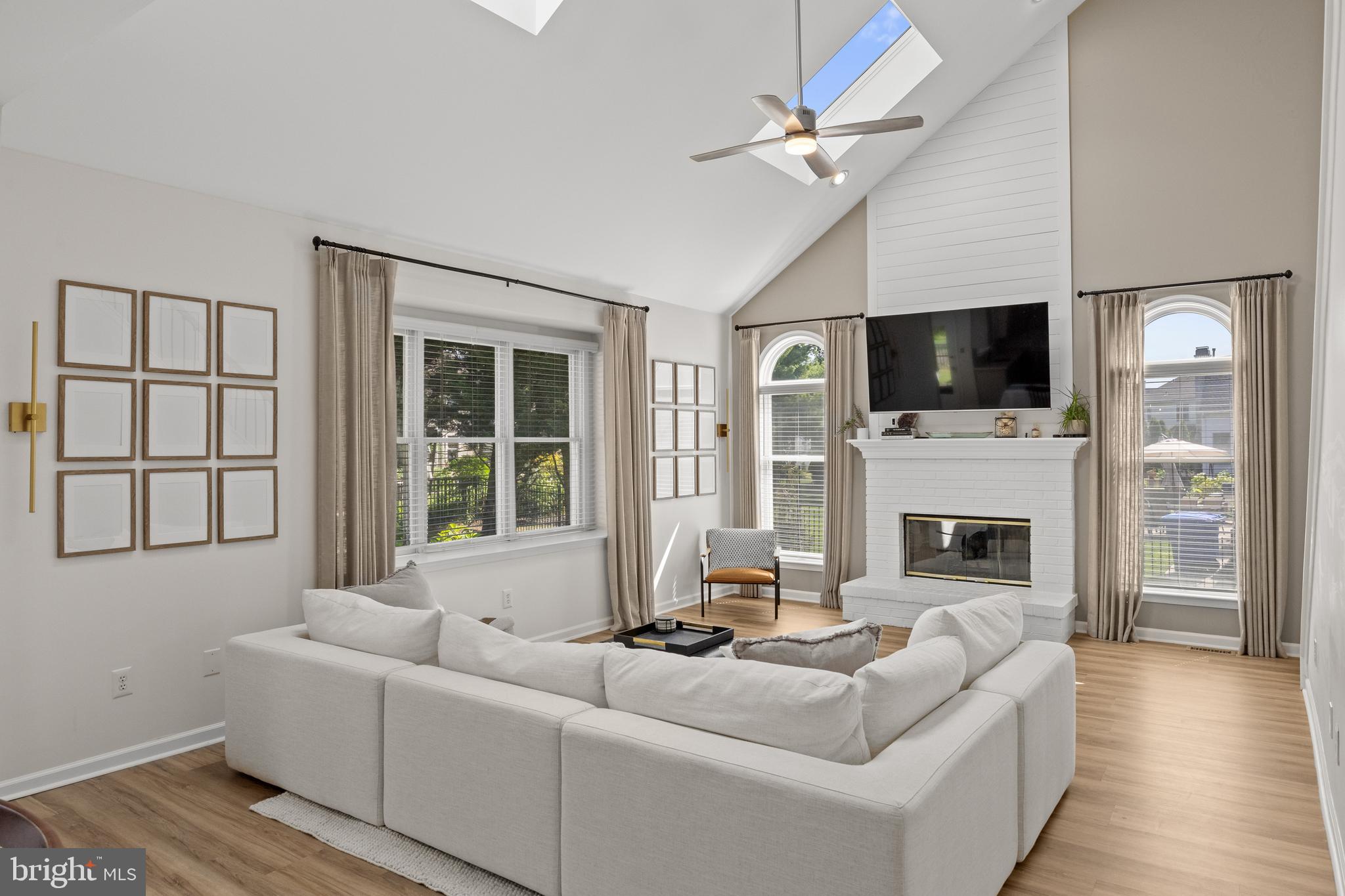 97 Brooks Road Moorestown, NJ 08057 - Photo 18 of 47 a living room with furniture a fireplace and a flat screen tv