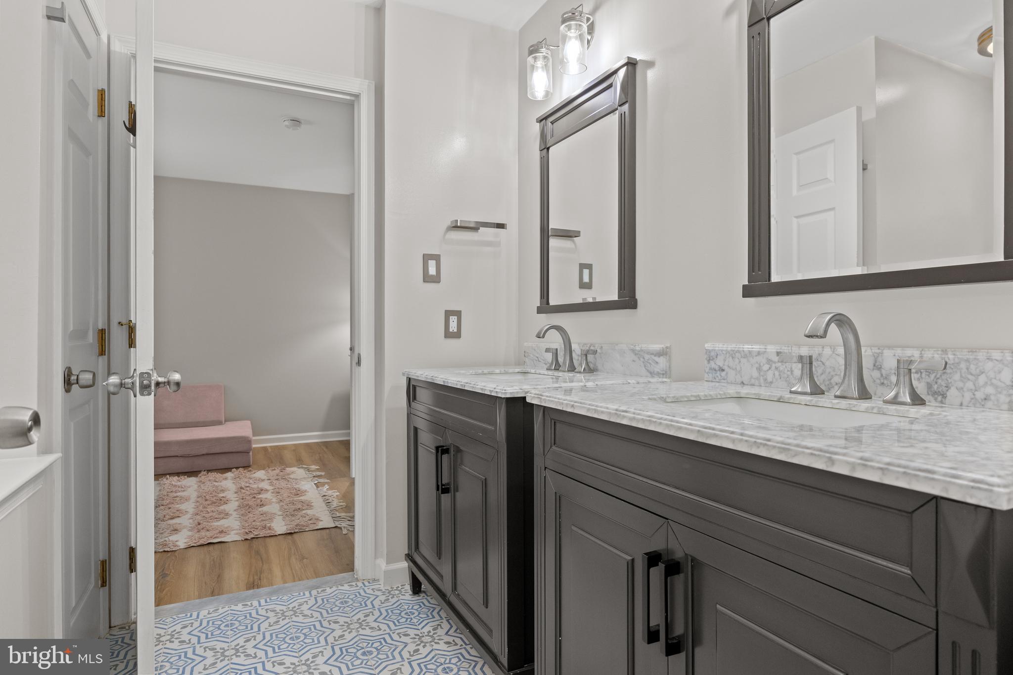 97 Brooks Road Moorestown, NJ 08057 - Photo 27 of 47 a bathroom with a granite countertop sink and a mirror