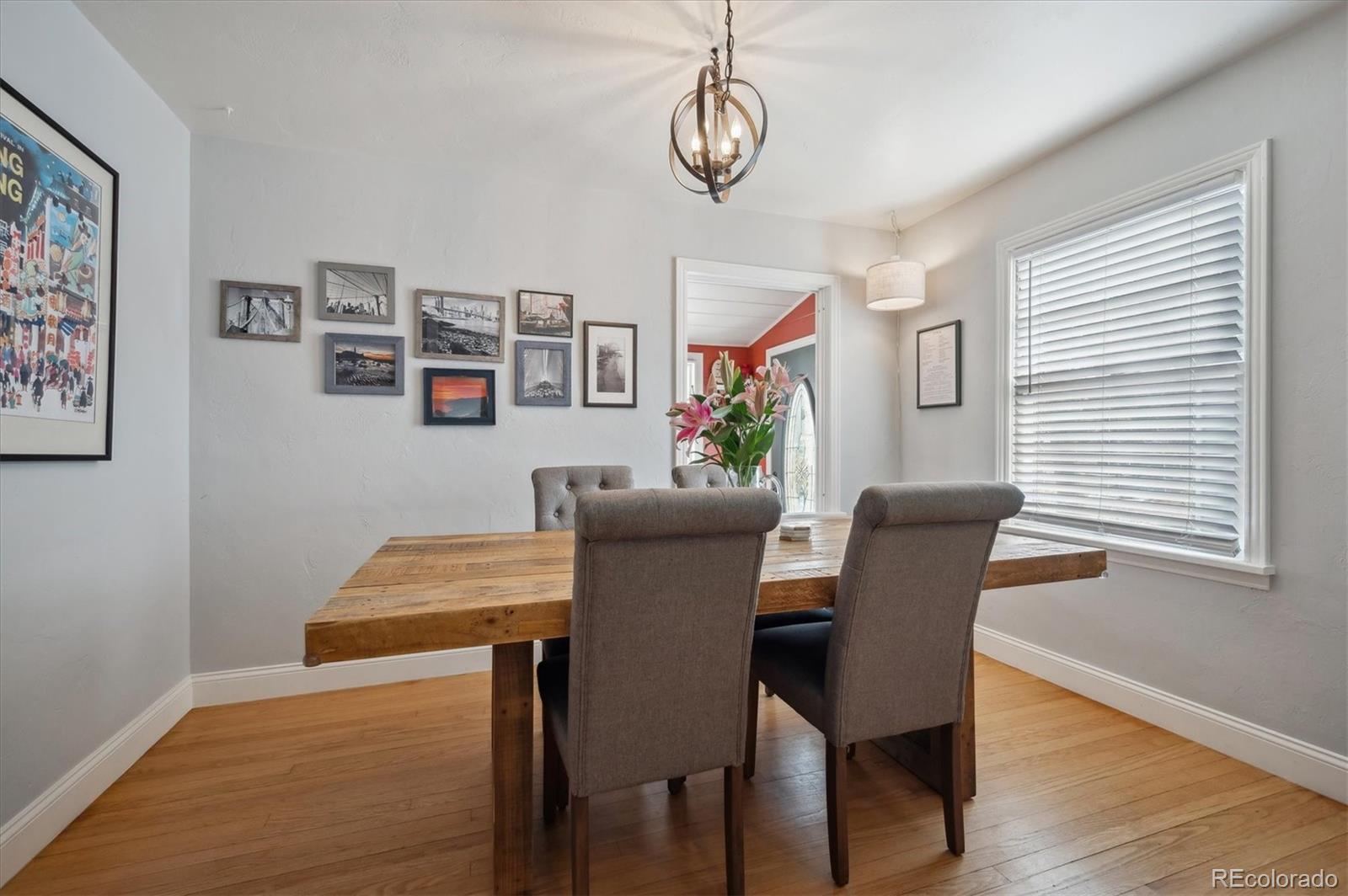 3885 Quay Street Wheat Ridge, CO 80033 - Photo 13 of 40 a view of a dining room with furniture and wooden floor