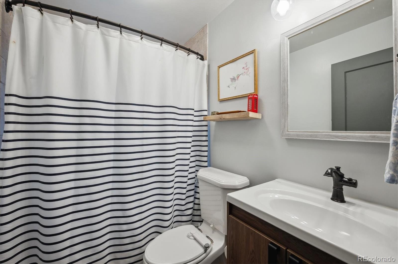 3885 Quay Street Wheat Ridge, CO 80033 - Photo 23 of 40 a bathroom with a sink and a toilet