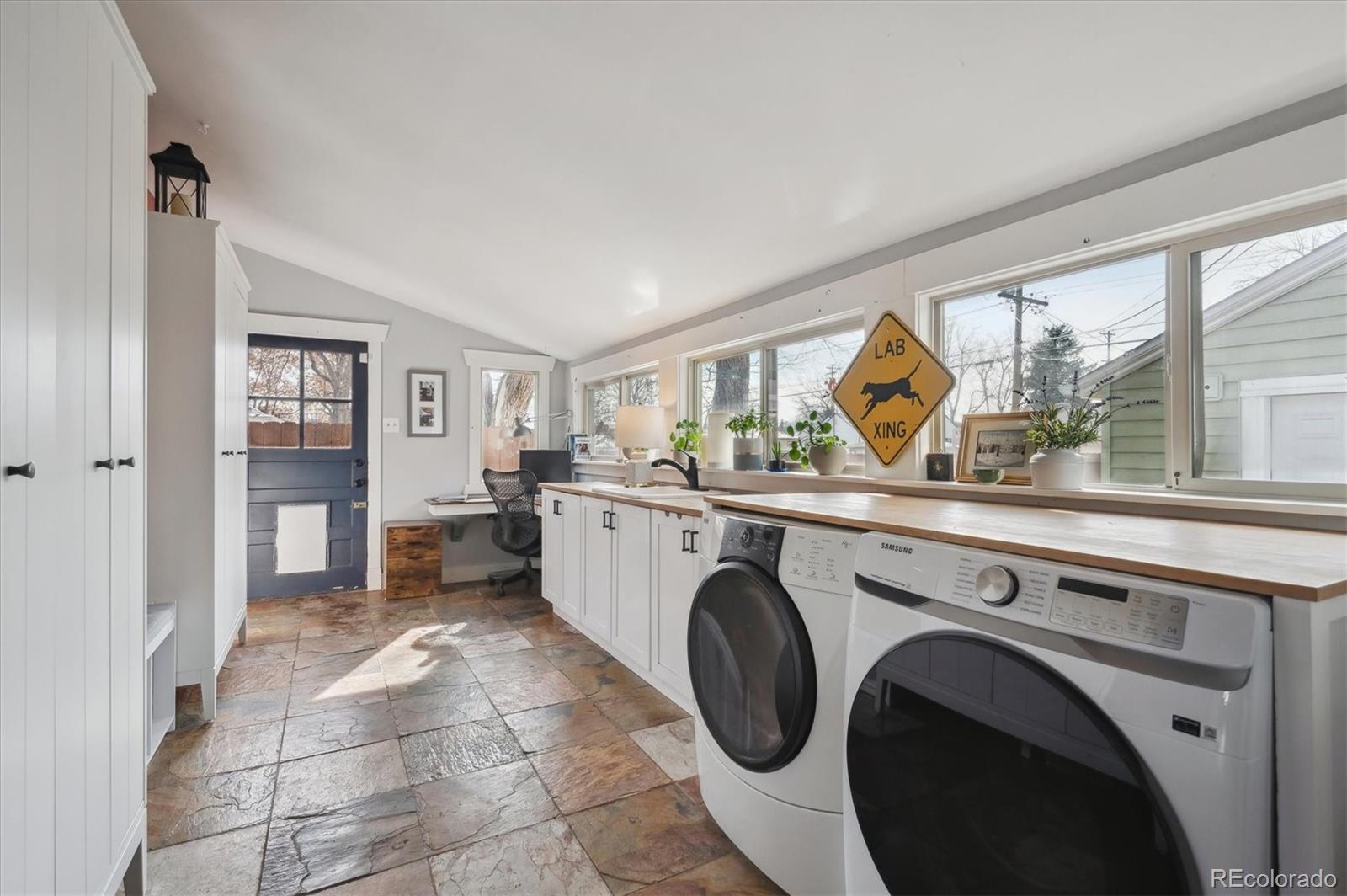 3885 Quay Street Wheat Ridge, CO 80033 - Photo 26 of 40 a view of a kitchen with a sink dryer and washer