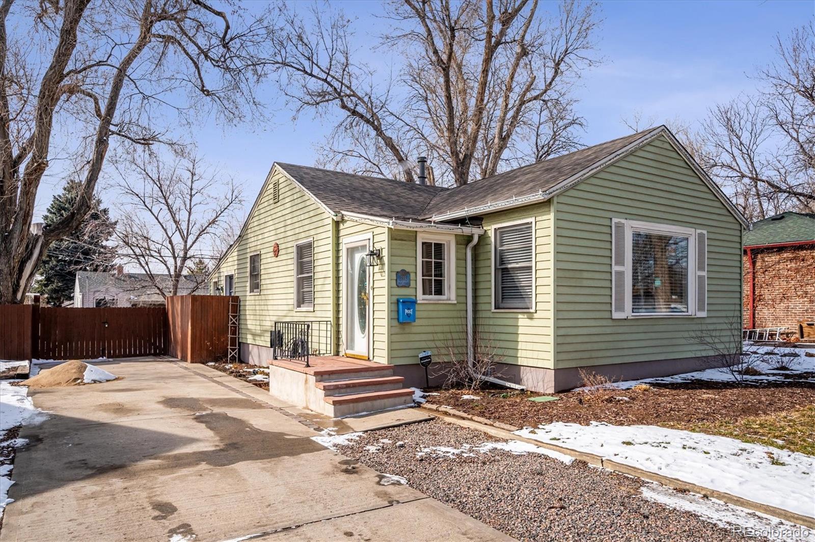 3885 Quay Street Wheat Ridge, CO 80033 - Photo 3 of 40 a front view of a house