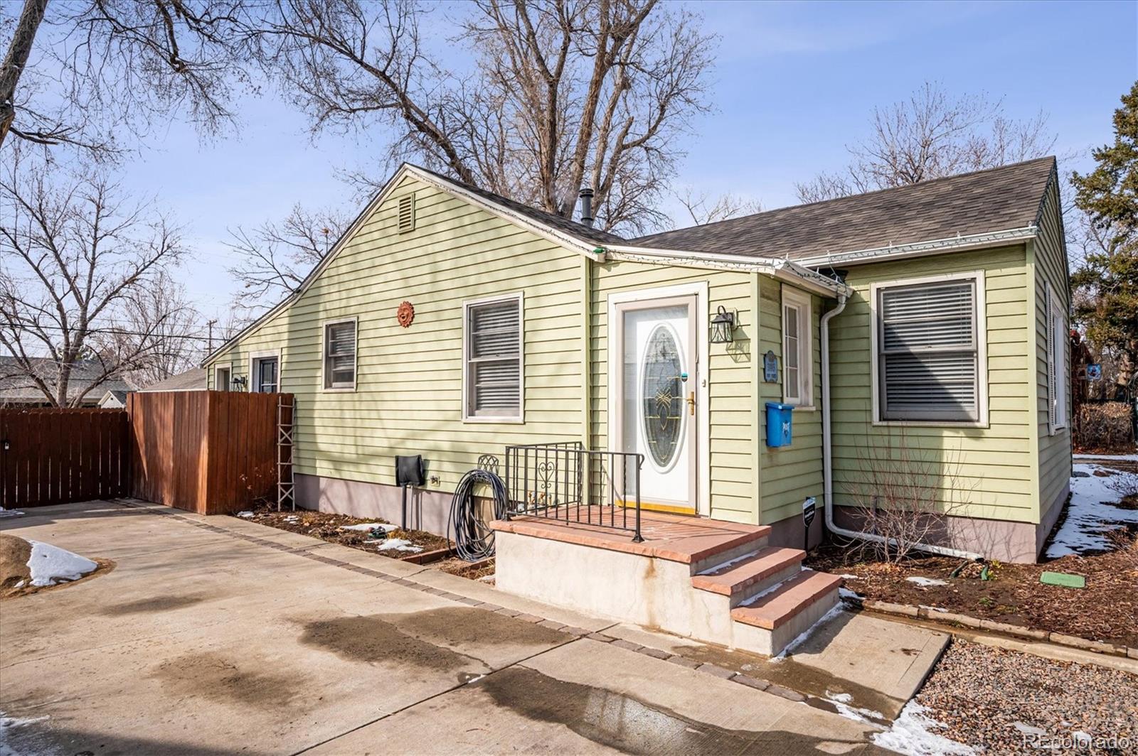 3885 Quay Street Wheat Ridge, CO 80033 - Photo 4 of 40 a view of a house with a patio