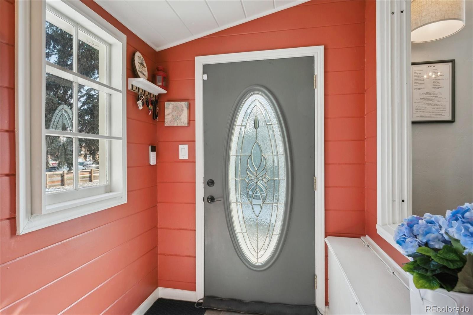 3885 Quay Street Wheat Ridge, CO 80033 - Photo 6 of 40 a front view of a house with entryway