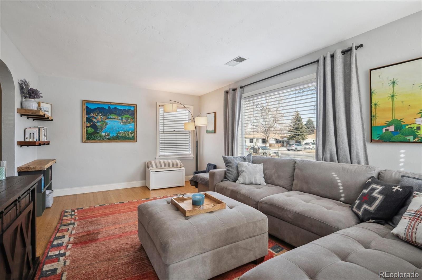 3885 Quay Street Wheat Ridge, CO 80033 - Photo 7 of 40 a living room with furniture and a large window