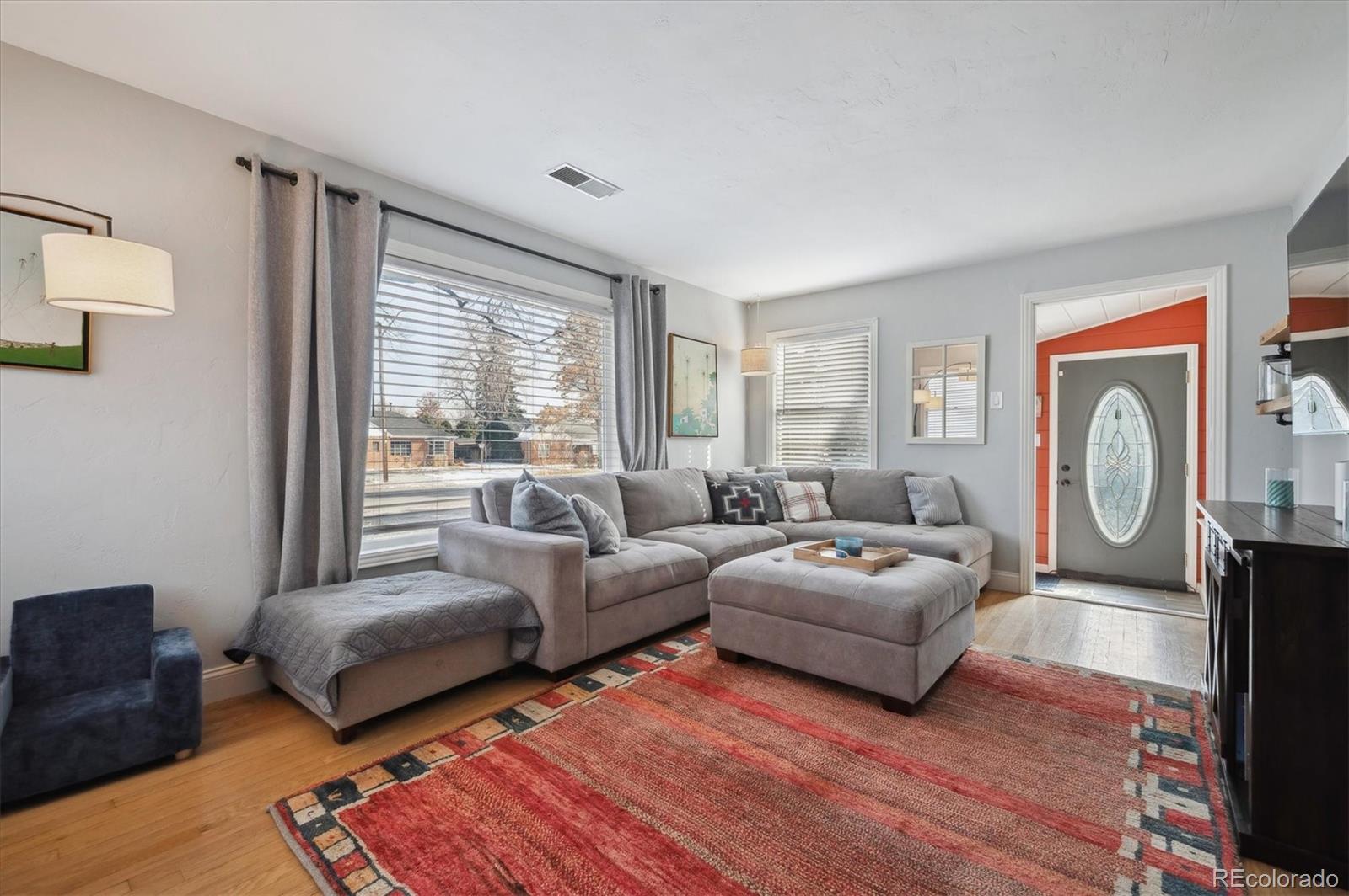 3885 Quay Street Wheat Ridge, CO 80033 - Photo 9 of 40 a living room with furniture and a large window