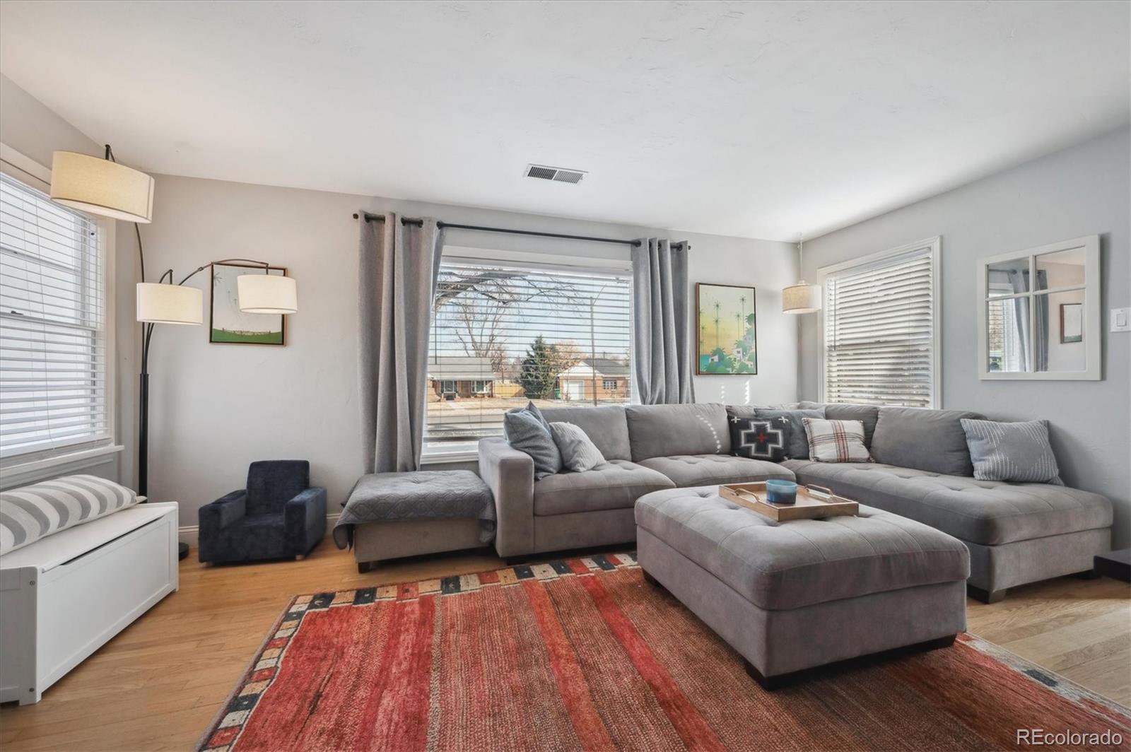 3885 Quay Street Wheat Ridge, CO 80033 - Photo 10 of 40 a living room with furniture and a large window
