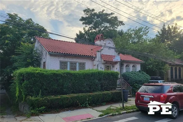 a front view of a house with garden