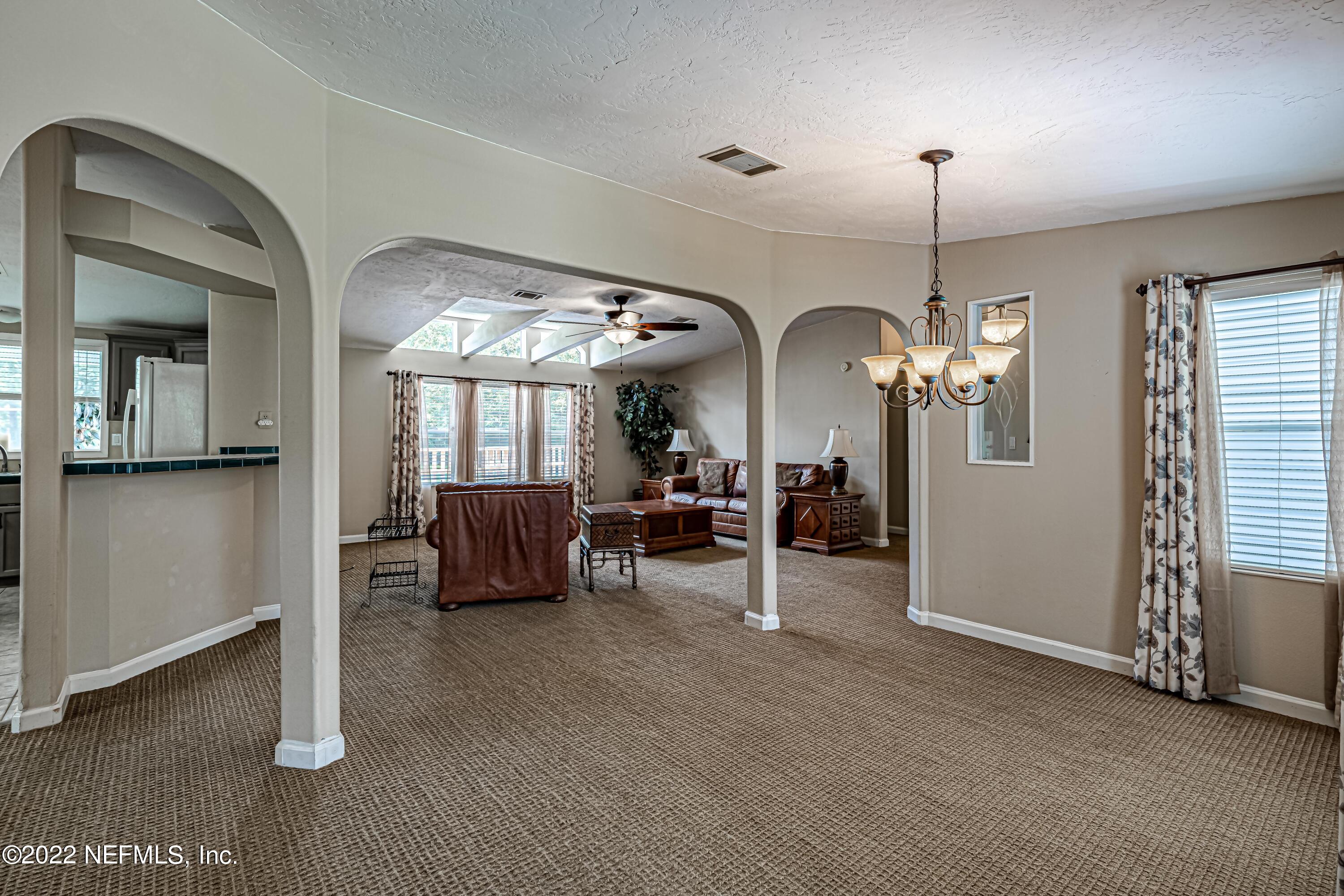 1376 Marlee Road, Unit 1 St. Johns, FL 32259 - Photo 11 of 50 a view of a livingroom with furniture window and a chandelier