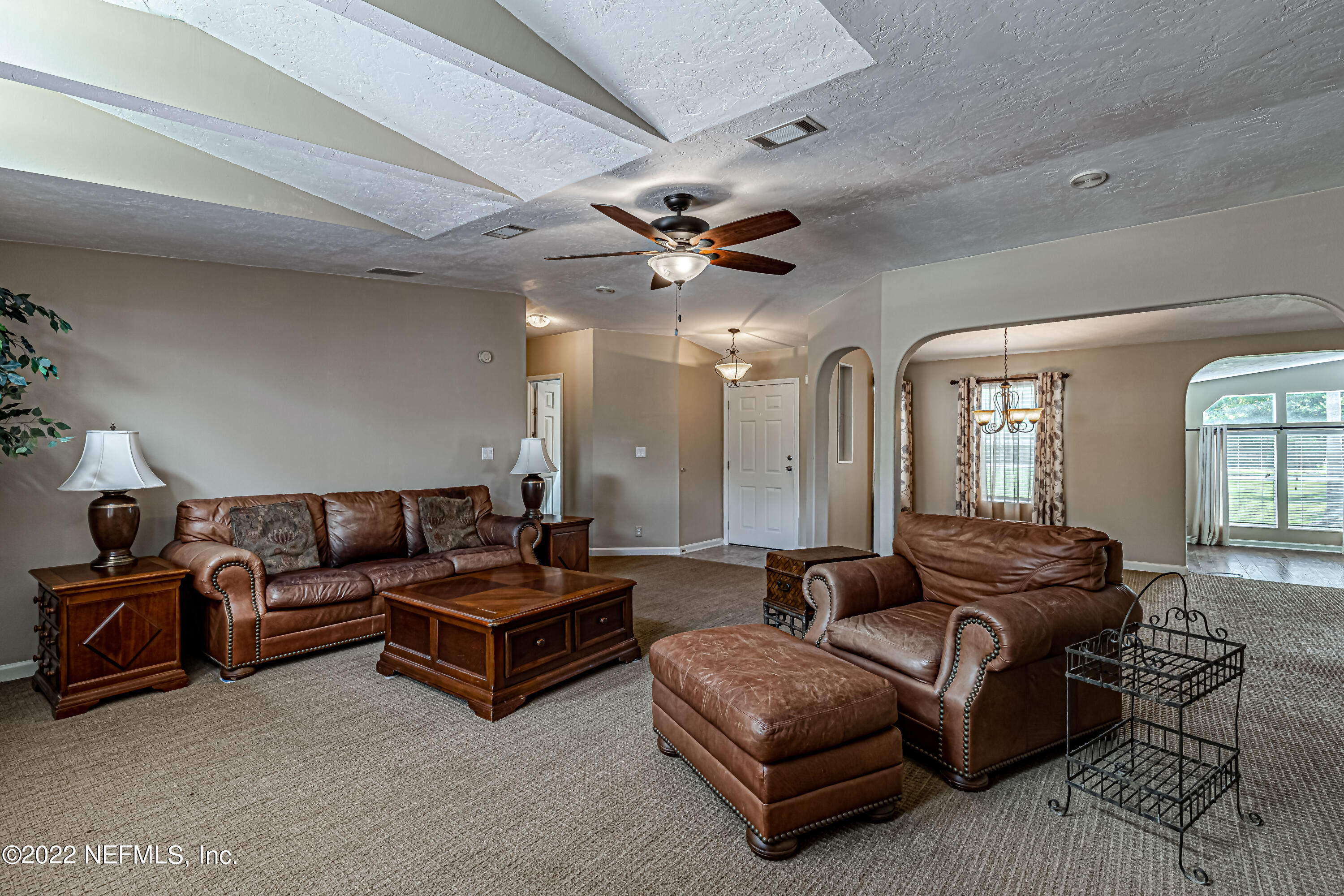 1376 Marlee Road, Unit 1 St. Johns, FL 32259 - Photo 12 of 50 a living room with furniture ceiling fan and a rug