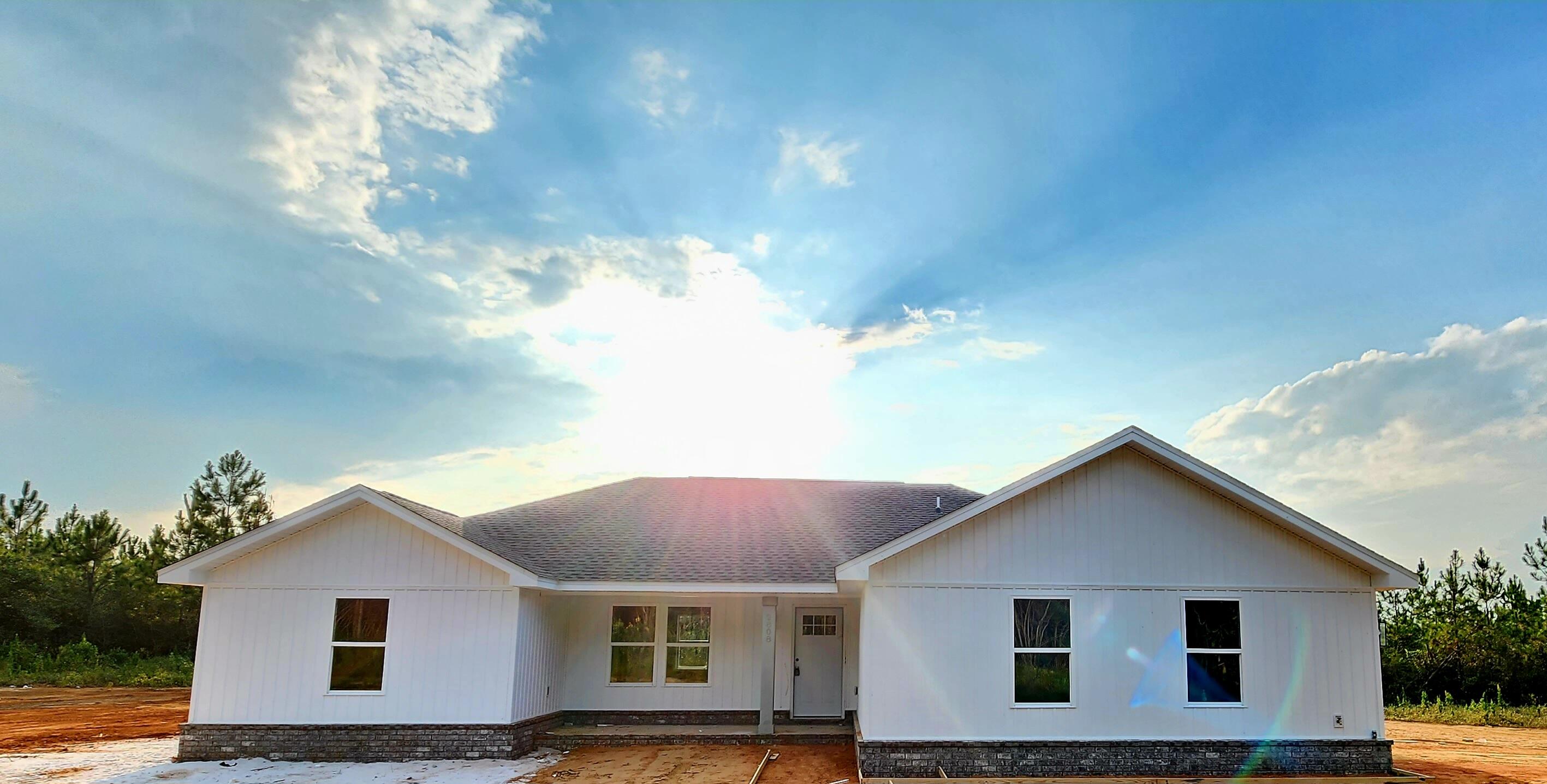 2808 Long Road DeFuniak Springs, FL 32433 - Photo 2 of 2 a front view of house with yard and trees in the background