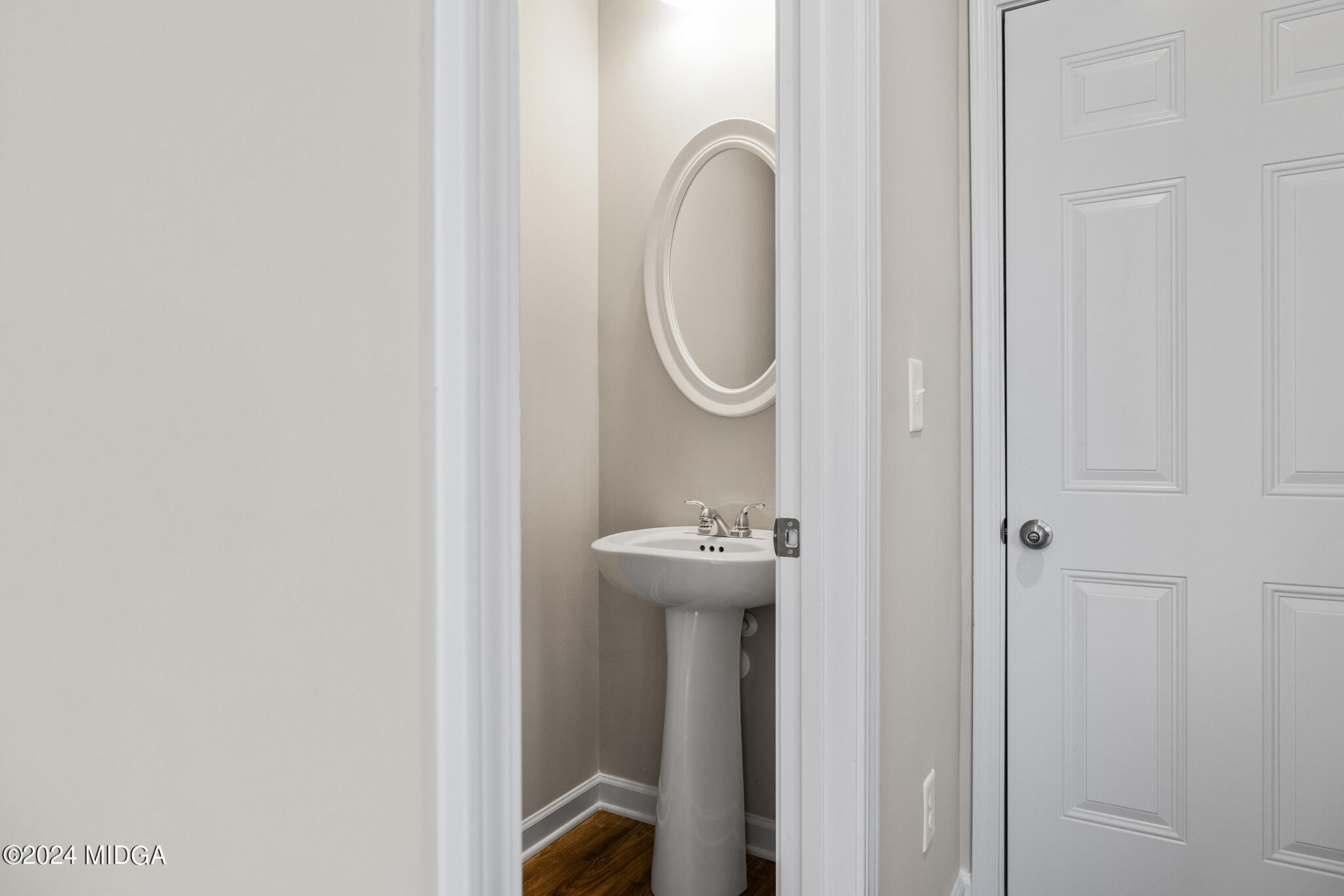 499 Grand Magnolia Street Jackson, GA 30233 - Photo 14 of 35 a bathroom with a sink and a mirror