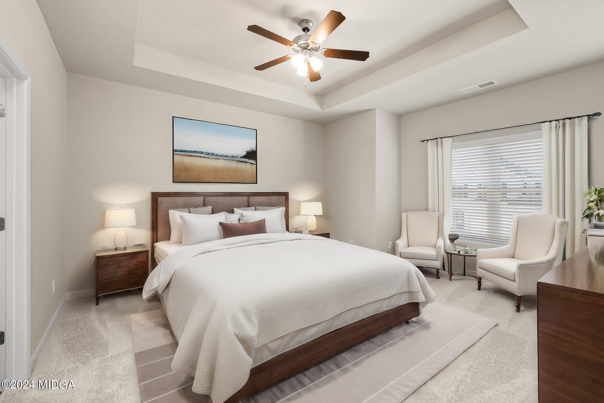 499 Grand Magnolia Street Jackson, GA 30233 - Photo 20 of 35 a bedroom with a large bed and a chandelier