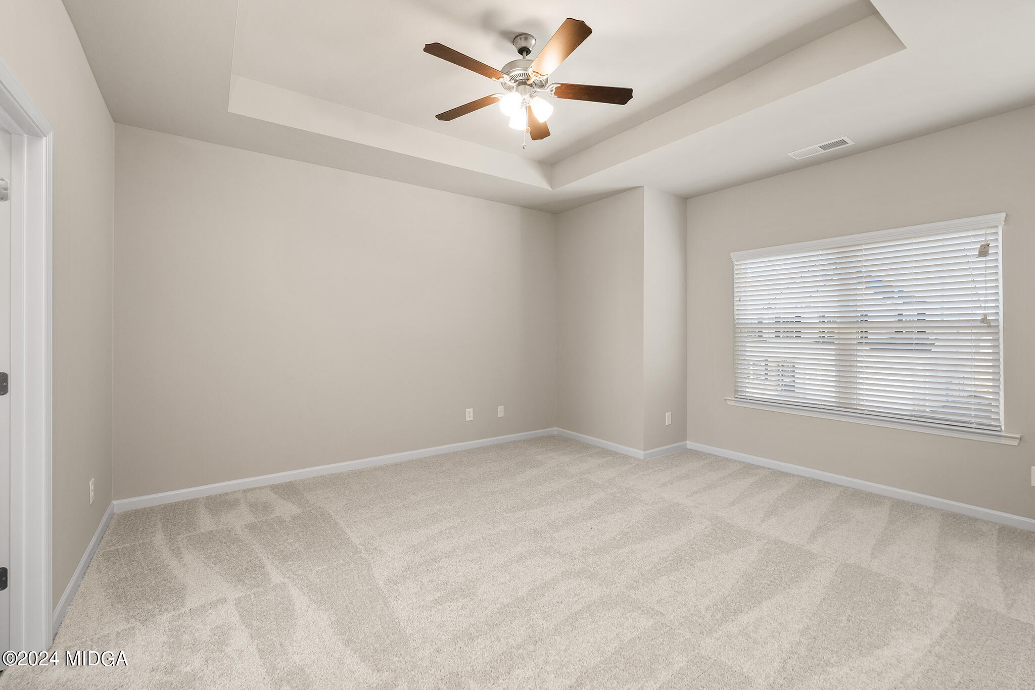 499 Grand Magnolia Street Jackson, GA 30233 - Photo 21 of 35 a view of an empty room with a window