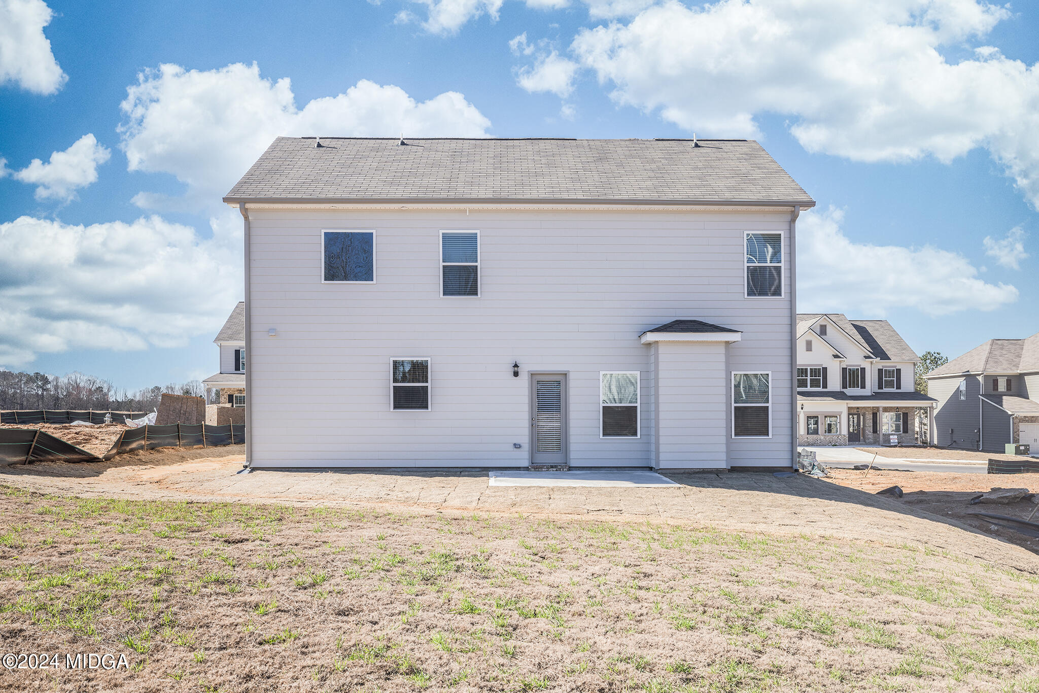 499 Grand Magnolia Street Jackson, GA 30233 - Photo 25 of 35 a view of a house with a yard