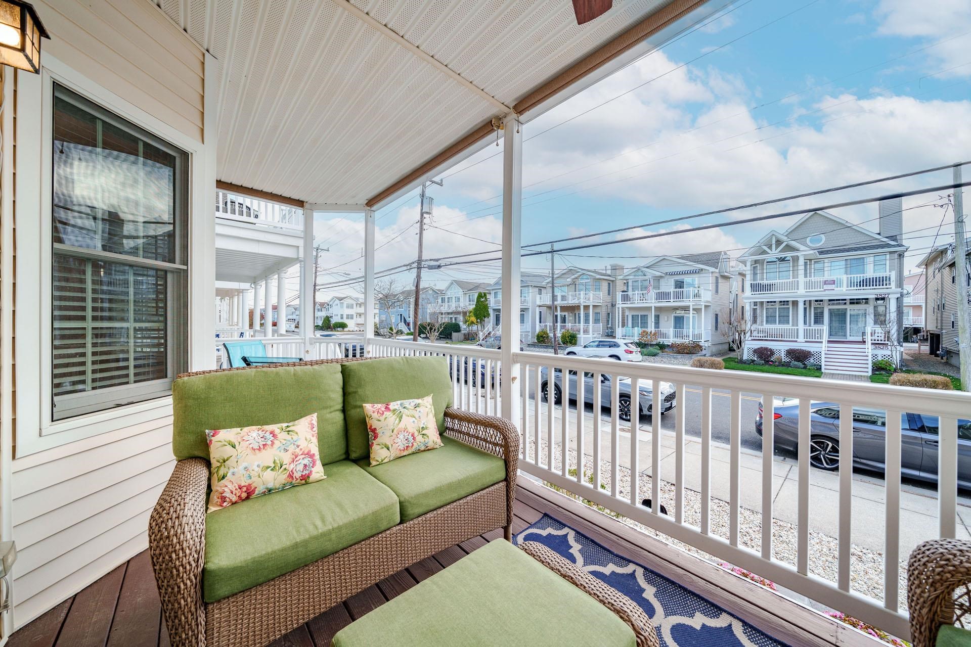 3824 Asbury Avenue, Unit 1 Ocean City, NJ 08226 - Photo 11 of 40 a balcony with furniture and a table
