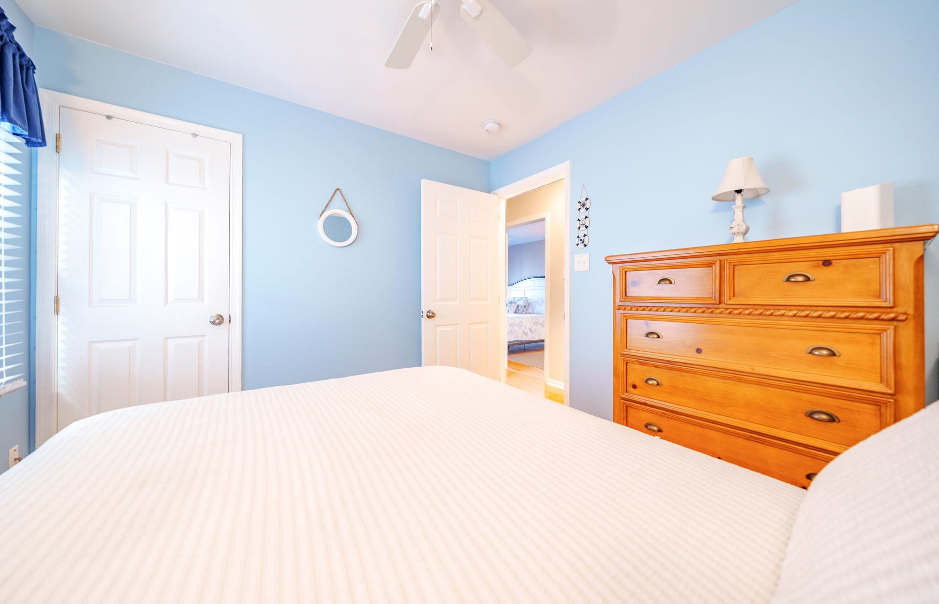 3824 Asbury Avenue, Unit 1 Ocean City, NJ 08226 - Photo 19 of 40 a bedroom with a bed and a dresser