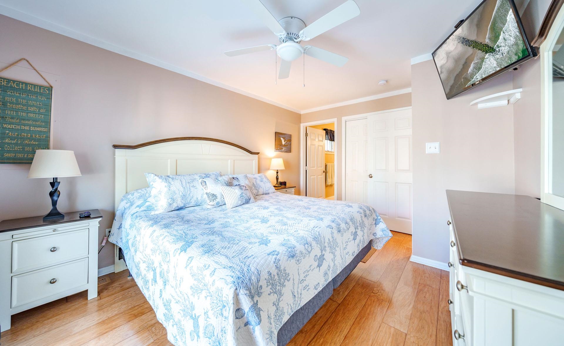 3824 Asbury Avenue, Unit 1 Ocean City, NJ 08226 - Photo 23 of 40 a bedroom with a bed and a couch