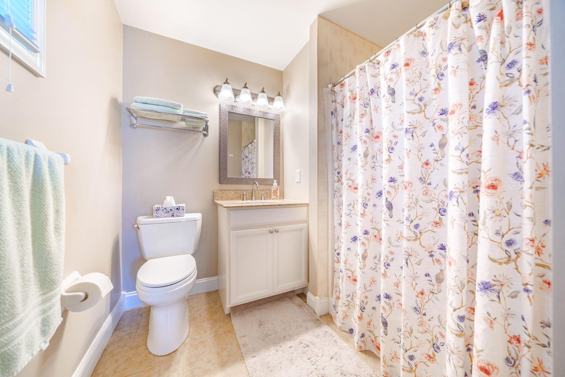 3824 Asbury Avenue, Unit 1 Ocean City, NJ 08226 - Photo 24 of 40 a bathroom with a toilet and a shower curtain