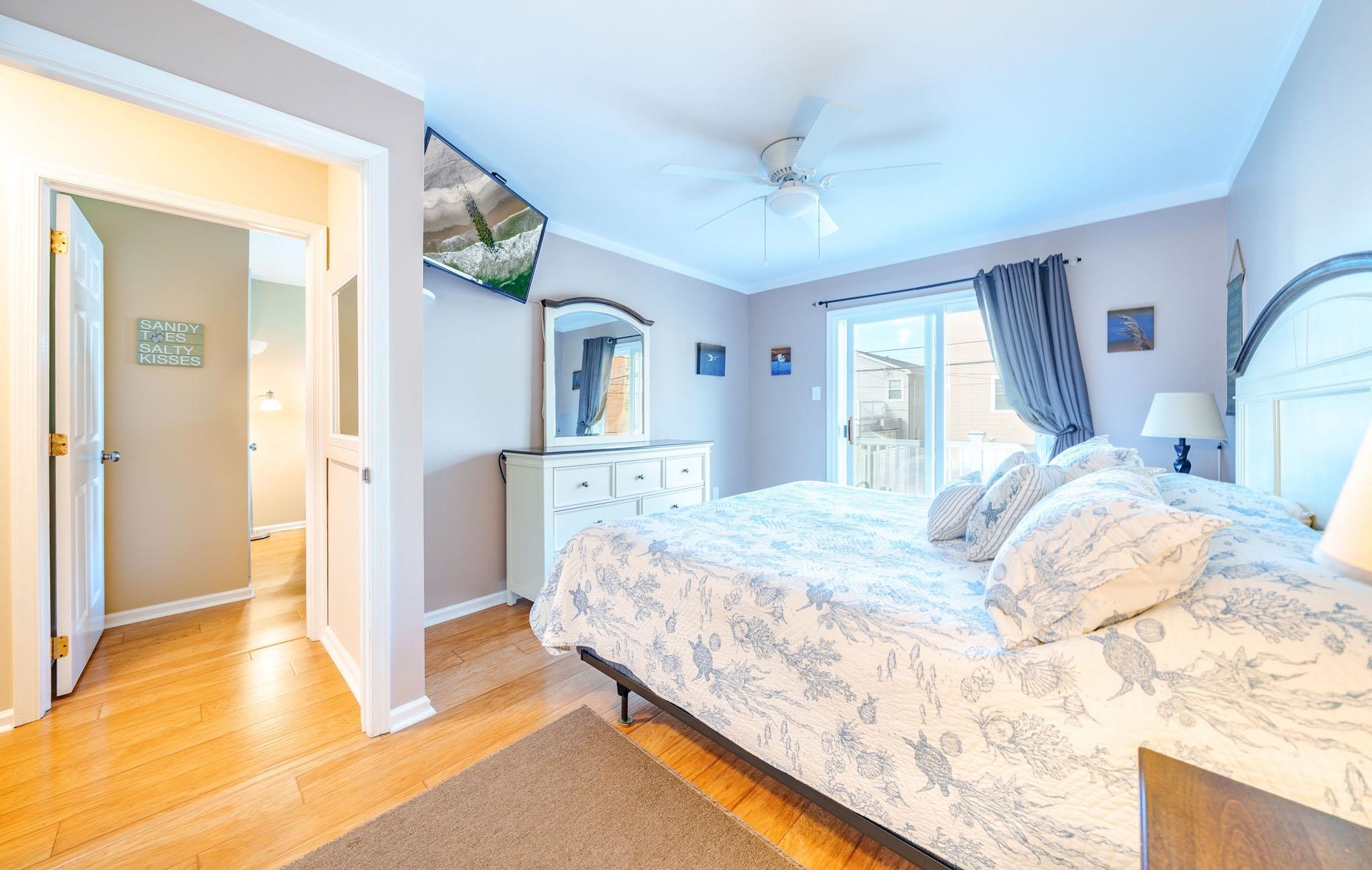 3824 Asbury Avenue, Unit 1 Ocean City, NJ 08226 - Photo 25 of 40 a bedroom with a bed and a cabinets