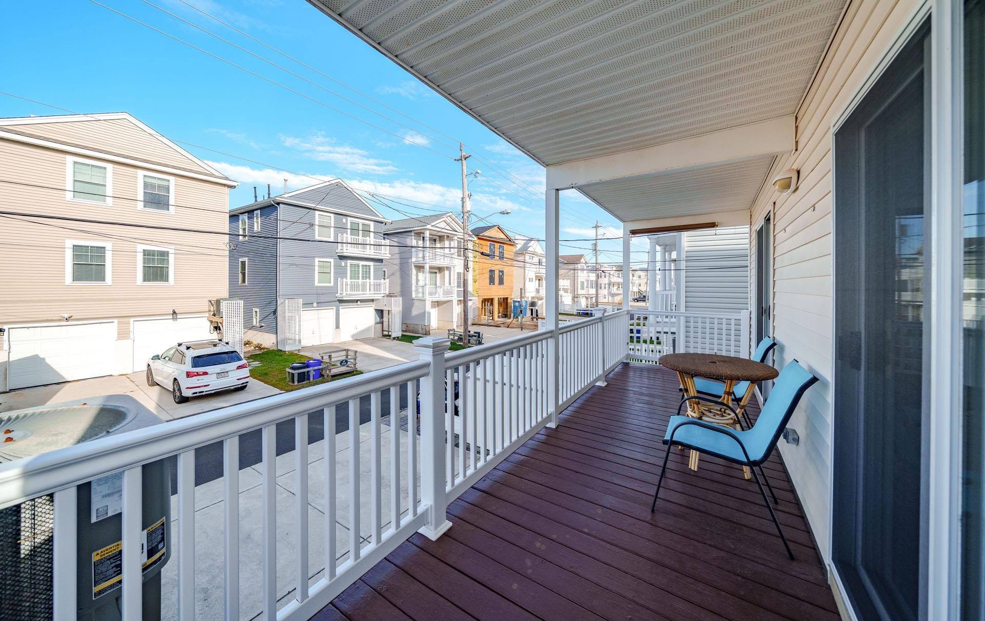 3824 Asbury Avenue, Unit 1 Ocean City, NJ 08226 - Photo 28 of 40 a view of a porch with furniture and wooden floor
